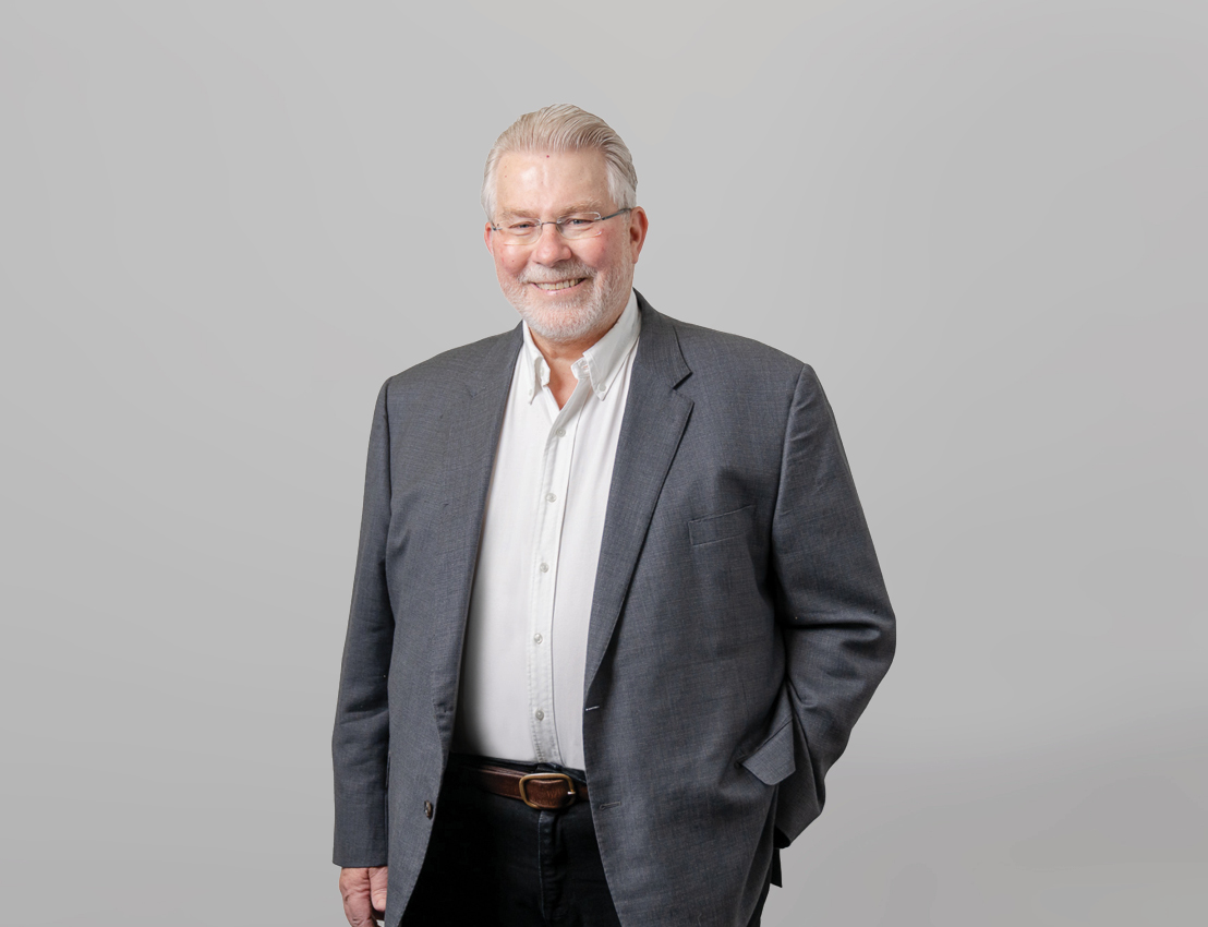 Dr John Russell  - $Founder and Director