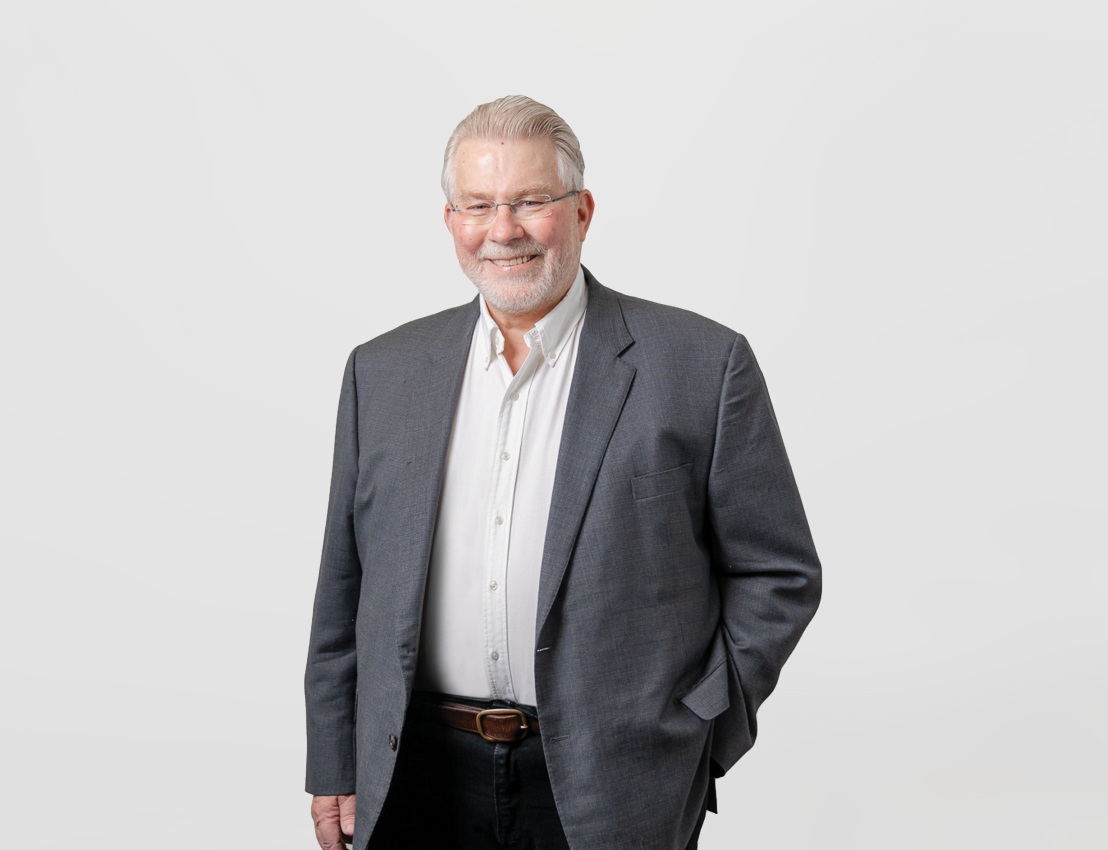 Dr John Russell  - $Founder and Director