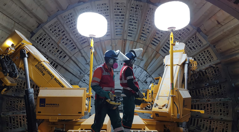 RUSSELL TWIN Mill Relining Machines with RUSSELL Millbrite in-mill lighting and two reline crew members